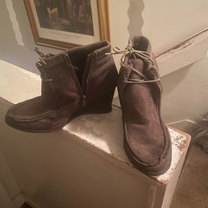 A pair of wedge boots